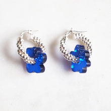 Load image into Gallery viewer, Textured twisted small silver hoops with blue flower pendant - AYR TAN
